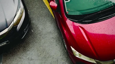 Rain falling down onto car windshield Stock Footage 309025139