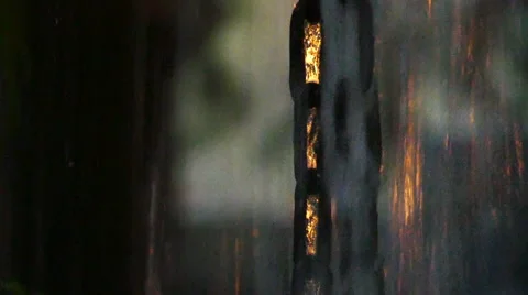 Rain falling down the chain, Slow motion Stock Footage 51659799