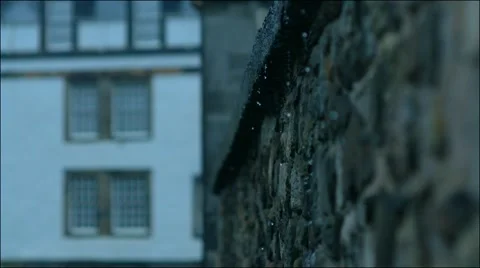 Rain falling down historical edinburghbuilding wall Video stock 65489228