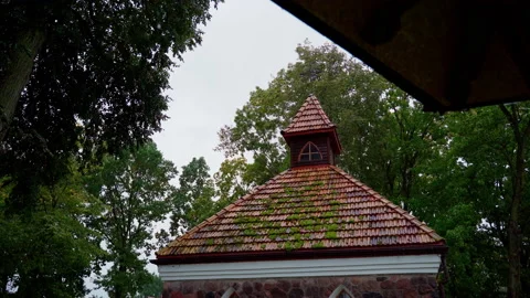 Rain falling down in park with old building on background Stock Footage 161087752