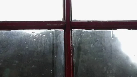 rain falling down a vintage window sash ... | Stock Video | Pond5