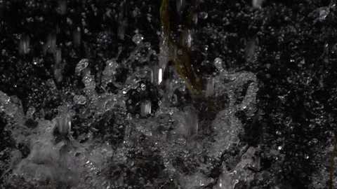 Rain falling drops on splashing water surface, slow motion Stock Footage 90344627