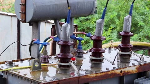 Rain Falling on Electrical Power Transformer at Outdoor Substation Close Up Stock Footage 339987687