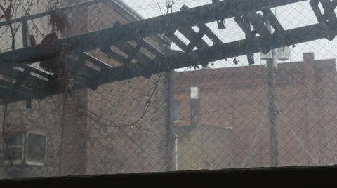 Rain Falling onto Fire Escape Ladder through Dirty Window 動画素材 61511028