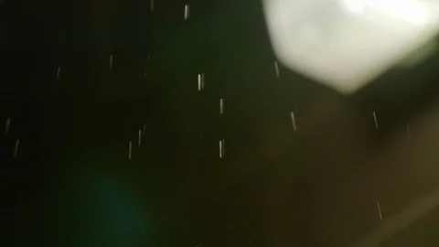 Rain falling in foreground and illuminated light in background at stadium Stock Footage 102105653