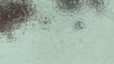 Rain falling on the fountain pool, 4k video Stock Footage 248083235