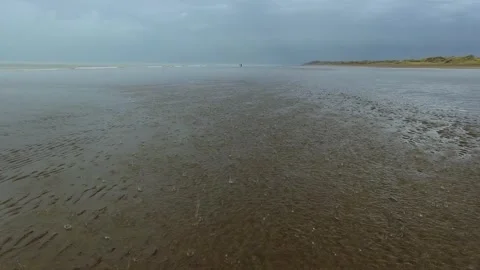Rain falling gently on the beach. 4k footage. Stock Footage 272276596