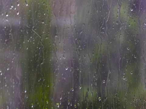 Rain falling on a glass Stock Footage
