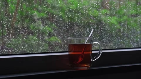 Rain falling on the glass window, flowing raindrops, the comfortable sound of Stock Footage 275882752
