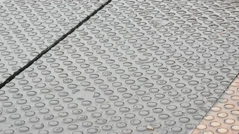Rain falling on the ground, train station industrial factory floor detail Stock Footage 171331910