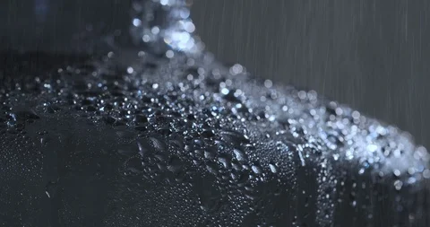 Rain Falling on Hard Dark Surface Stock Footage 121442959