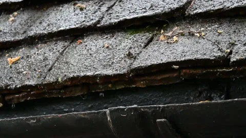 Rain falling hard on old roof tiles Stock Footage 244071048