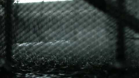 Rain Falling on Industrial Building Exterior at Night Vidéo 337042353