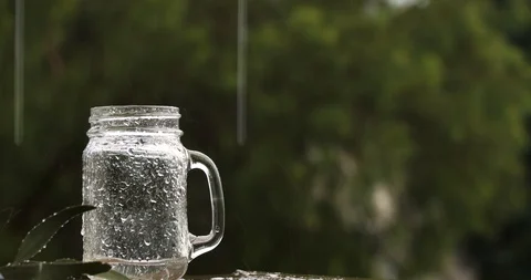 Rain falling in a jar Stock Footage 126308855