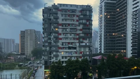 Rain falling over Batumi skyline, high-angle view of apartment towers Stock Footage 345361644