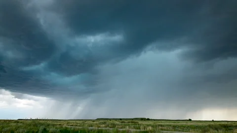 Rain falling over open fields Stock Footage 272712077