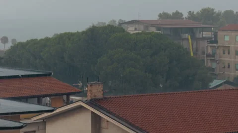 Rain Falling Over The Roofs Of A Small Town Stock Footage 283761916