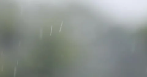 Rain falling over a soft blurred gray background. Atmospheric motion backgr.. Stock Footage 340224965