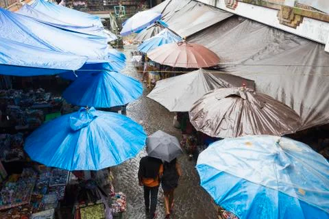 Rain falling over tarps and awnings of market stalls, Ubud, Bali, Indonesia Fotos Stock