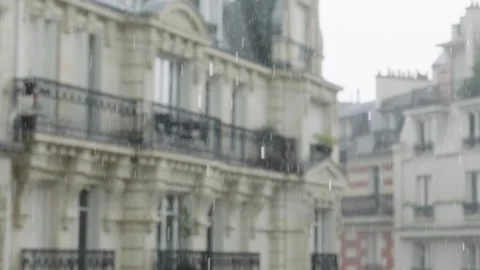Rain falling in paris on blurred typical buildings Stock Footage 309298838