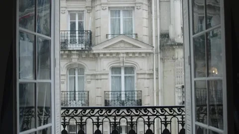 Rain falling on parisian building seen through open window Stock Footage 312998639