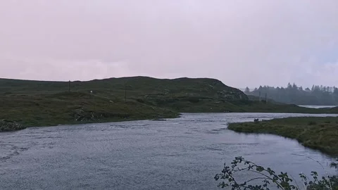 Rain falling on river and lake in scenic irish countryside landscape Stock Footage 347902822