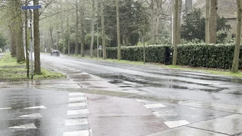 Rain falling on road creating difficulties for traffic passing by Stock Footage 277843512