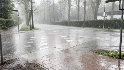 Rain falling on road creating difficulties for traffic passing by Stock Footage 278374682