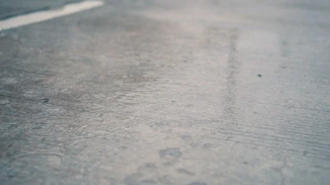 Rain falling on the road in slow motion. Stock-Footage 92459679