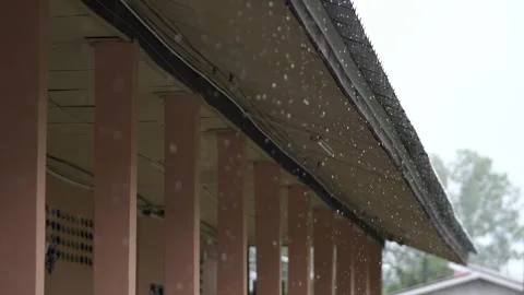 Rain Falling on Roof Eaves During Storm – Raindrops, Weather, and Rainy Season Stock Footage 322007059