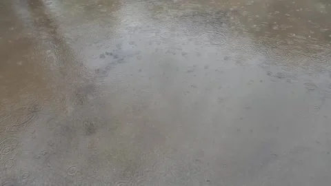 Rain falling on the sidewalk Stock Footage 331852168