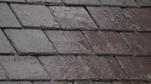 Rain falling on the slate roof and dripping Stock Footage 98745708