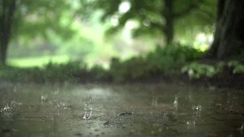 Rain falling on a stone pathway in super slow motion Stock Footage 93782452