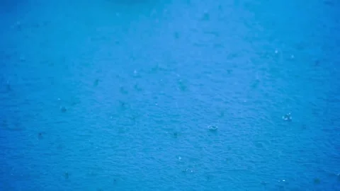 Rain is falling on the surface of the water. Video stock 283066063
