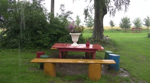 Rain falling on table outdoors Stock Footage 64986121
