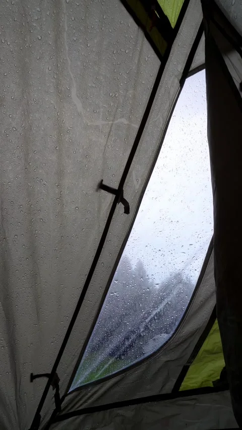 Rain Falling on a Tent - Inside View of Camping Shelter During Rainstorm Stock Footage 283917655