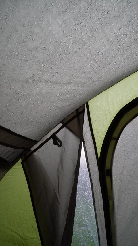 Rain Falling on a Tent - Inside View of Camping Shelter During Rainstorm Stock Footage 283917781