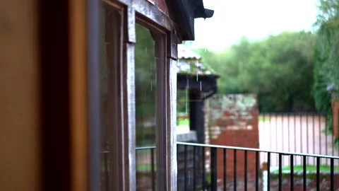 Rain falling through a window at a countryside wedding venue Stock Footage 131341469