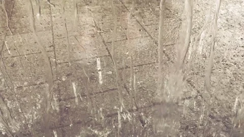 Rain falling on an urban pavement Stock Footage 95913458