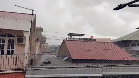 Rain Falling on Urban Rooftops - Atmospheric City View 動画素材 308817238