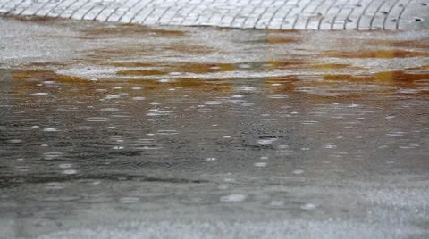 Rain falling in a water pool in the street, Tokyo, Japan Video stock 52260876