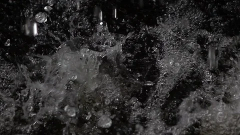 Rain falling on water slow motion Stock Footage 90803532