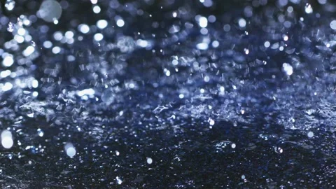 Rain falling on water surface Video stock 165030264