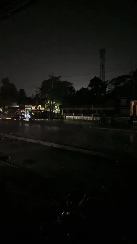Rain Falling on Wet Asphalt Highway Road at Night with Passing Vehicle Stock Footage 345360835