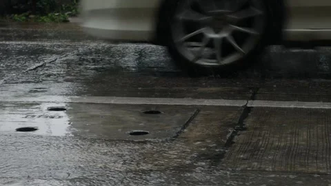 Rain Falling on Wet Concrete Pavement with Drainage Cover Stock Footage 340186457