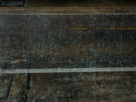 Rain Falling on Wet Concrete Pavement with Drainage Cover, Rainy Weather Te.. Fotos Stock