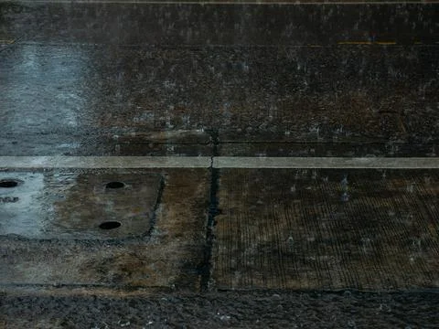 Rain Falling on Wet Concrete Pavement with Drainage Cover, Rainy Weather Te.. Photos
