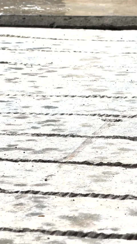 Rain Falling on Wet Grooved Concrete Pavement - Vertical 4K Stock Footage 346007160