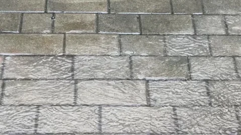 Rain Falling on Wet Stone Pavement Footage Close Up Stock Footage 334857905