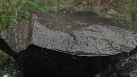 Rain Falling on Wet Stone Surface in Outdoor Natural Setting Stock Footage 337438965